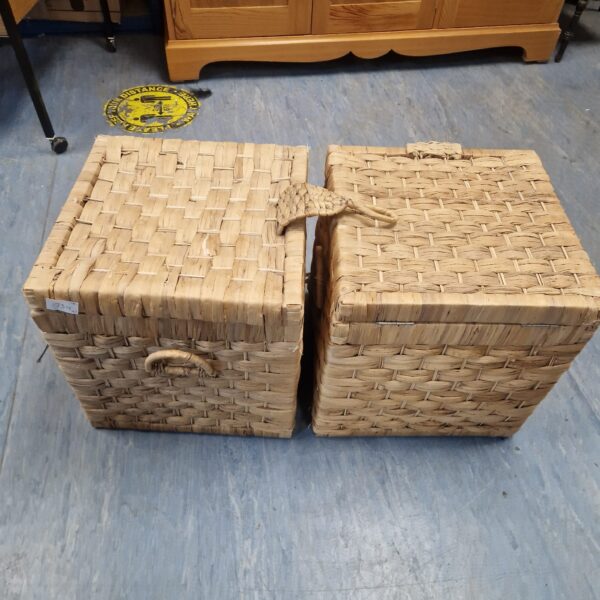 Pair of square wicker storage boxes for home organisation.