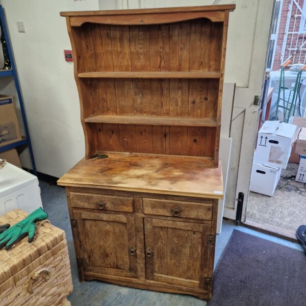 Antique pine Welsh dresser for farmhouse kitchen storage.