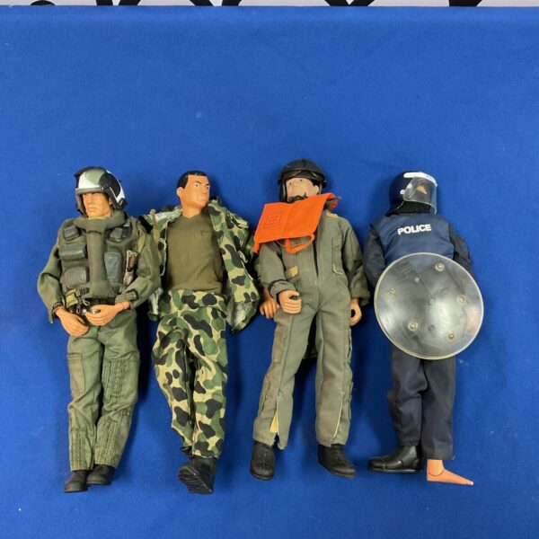Vintage action figure lot including M&C police riot figure.