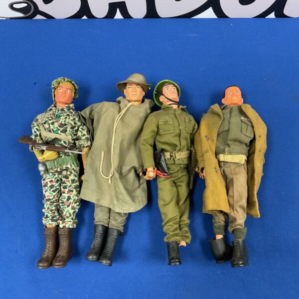 Vintage 1964 Palitoy Action Man figures with uniforms, a collectible toy lot.