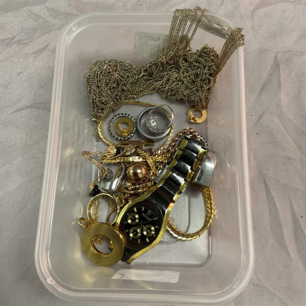 Tray of mixed jewellery including necklaces and bracelets.