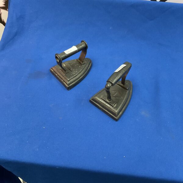 Pair of antique Victorian cast iron flat irons for clothing.