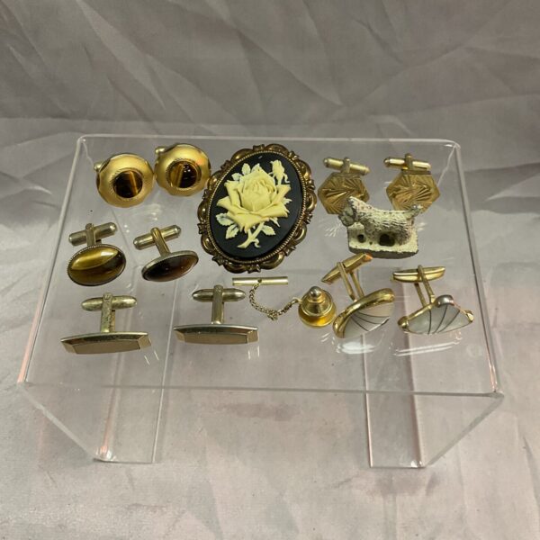 Vintage gold-tone cufflinks and tie pin set displayed for sale.