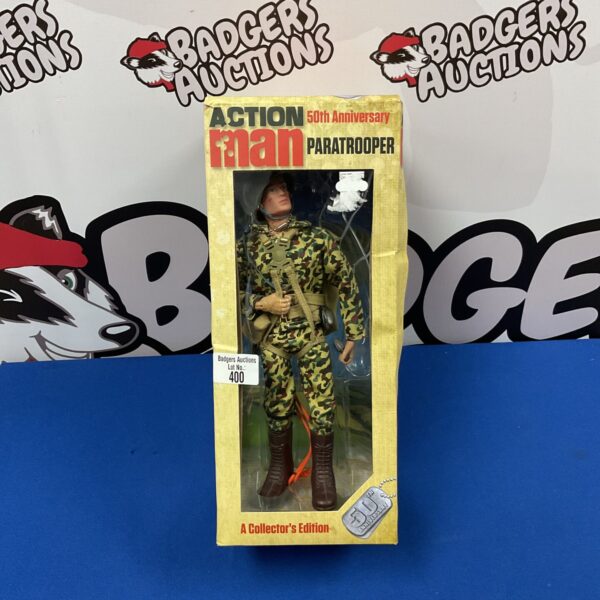 Vintage Action Man 50th Anniversary Paratrooper figure in camouflage uniform.