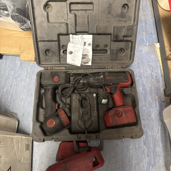 Snap On cordless impact gun set in open carry case.