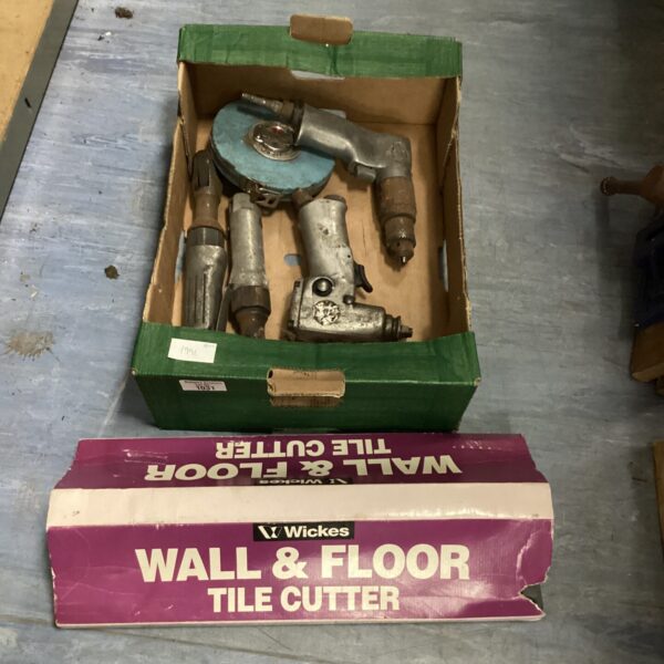 Vintage pneumatic tile cutter for cutting tiles in workshop.