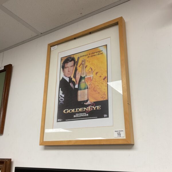 Framed vintage Bollinger champagne James Bond 007 poster for collectors.