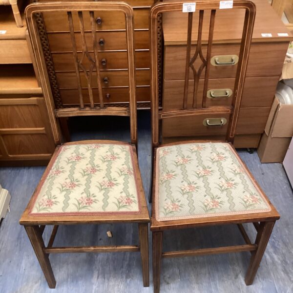Pair of antique Victorian mahogany inlaid chairs with upholstered seats.