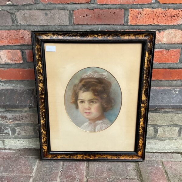 Delicate Edwardian pastel portrait of a young girl with ribbon.