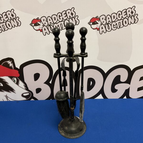 Vintage black iron fireplace companion set with tools.