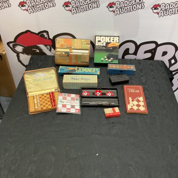 Vintage games lot including pocket chess, dice, and dominos.