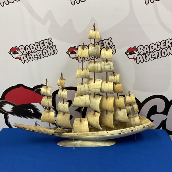 Intricate vintage bone sailing ship model with detailed rigging.