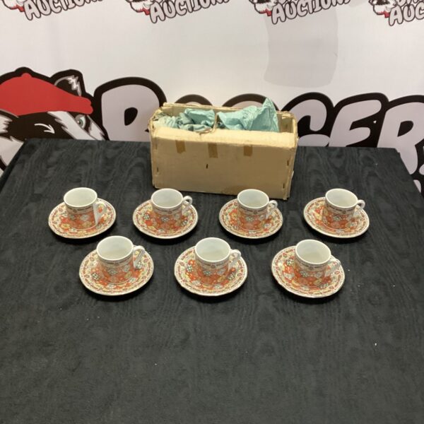 Vintage Japanese porcelain coffee cup set with floral design.