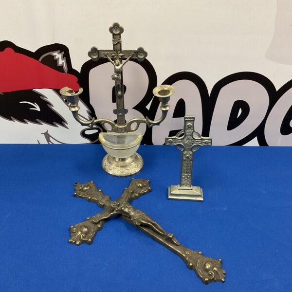 Antique crucifix lot featuring religious art and a wall cross.