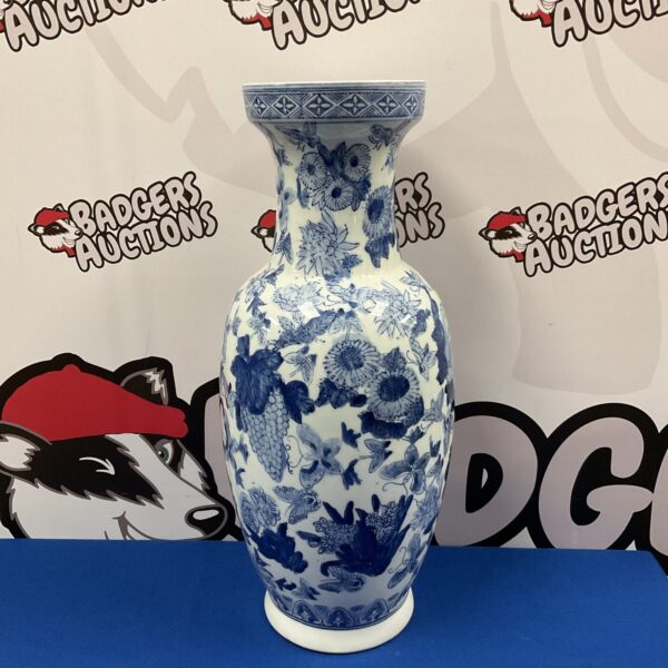 Large Chinese blue and white porcelain vase with butterfly pattern.