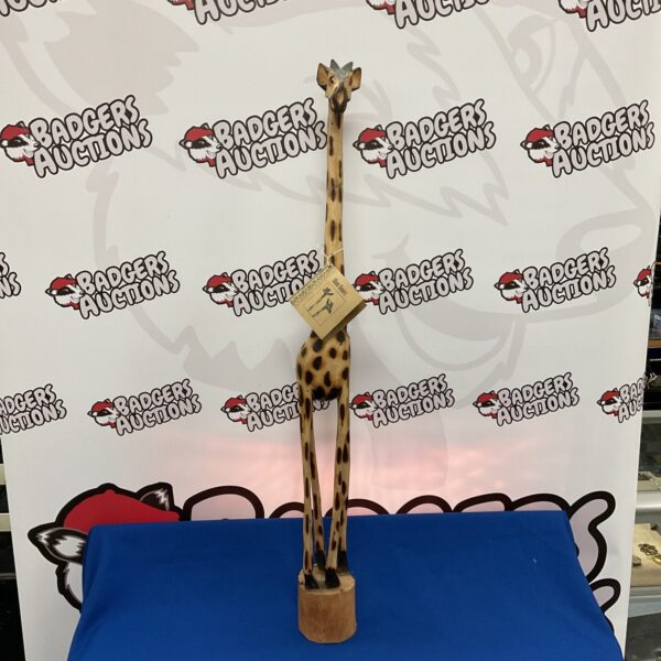 Hand-carved wooden giraffe sculpture by Mishack Musevenza.