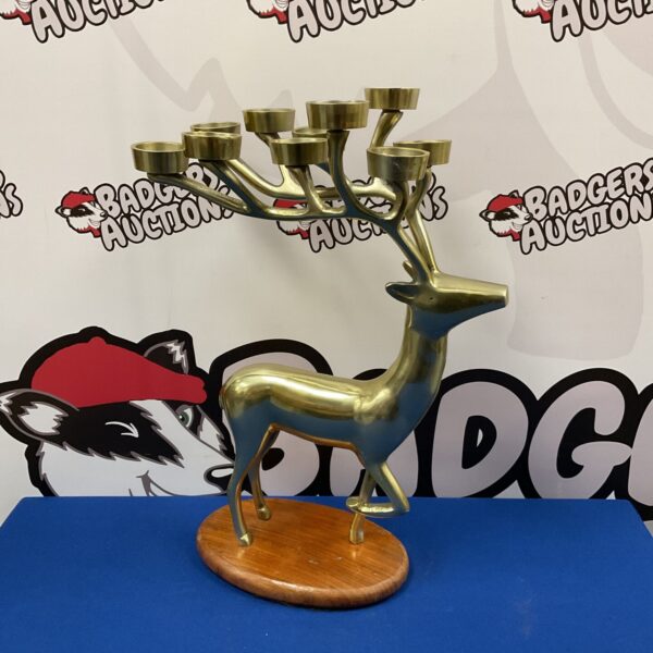 Detailed metal stag tealight holder for home decor.