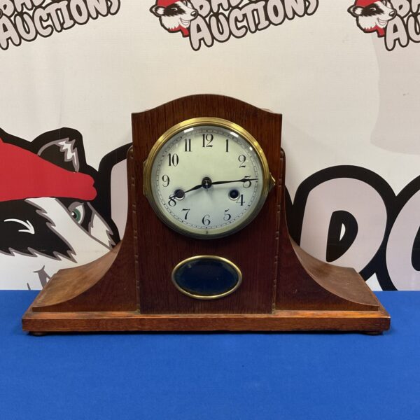 Front view of a vintage Art Deco mantle clock.