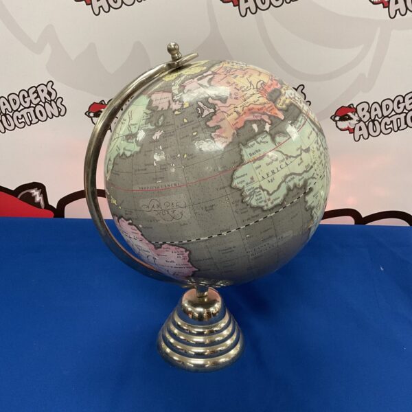 Vintage desktop globe on aluminium base, detailed cartography.