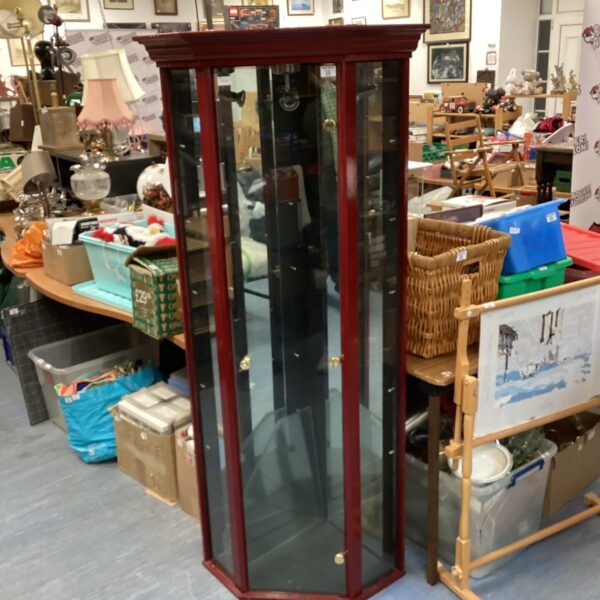 Dark wood antique corner display cabinet with glass sides.