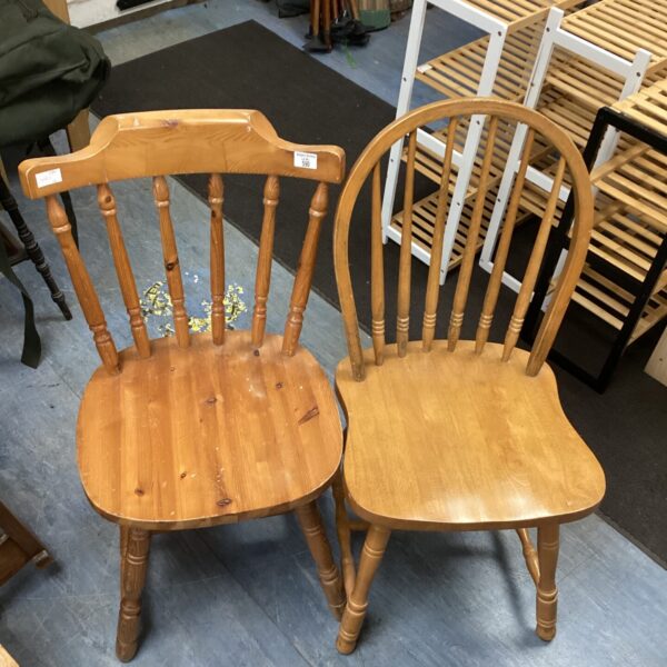 Pair of vintage wooden stick back chairs for farmhouse style.
