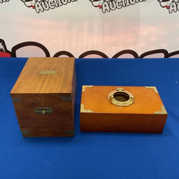 Vintage nautical tissue box with brass porthole detail.