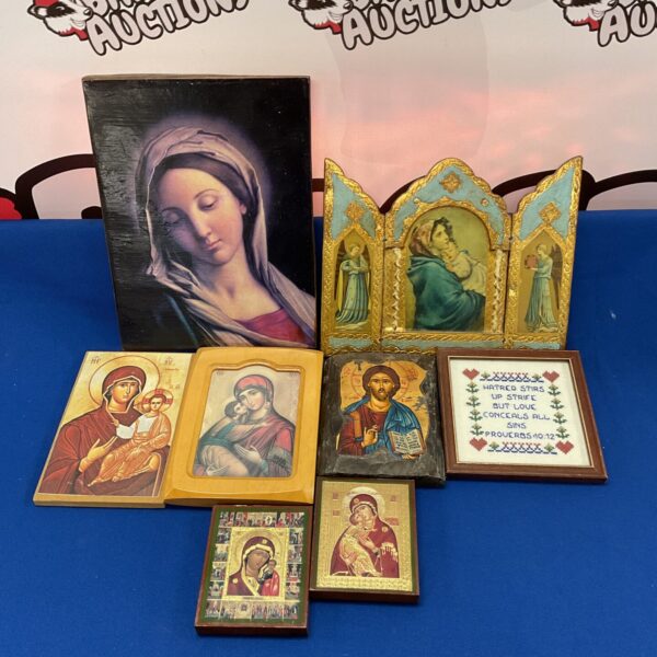 Collection of vintage wooden religious icons depicting religious figures.