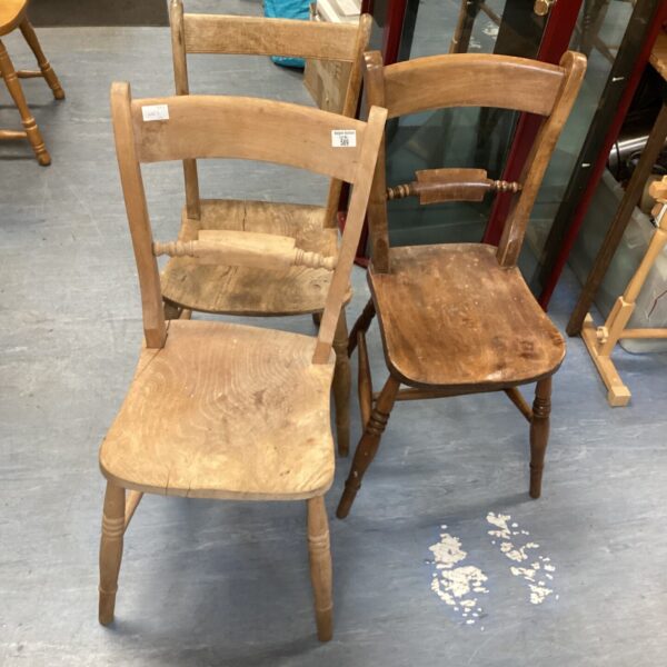 Set of three antique scroll back chairs with wooden seats.