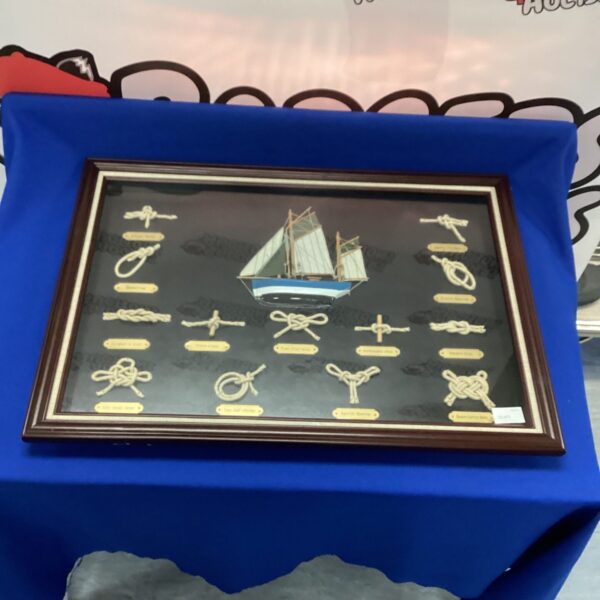 Framed ship knot display with intricate nautical knotwork.