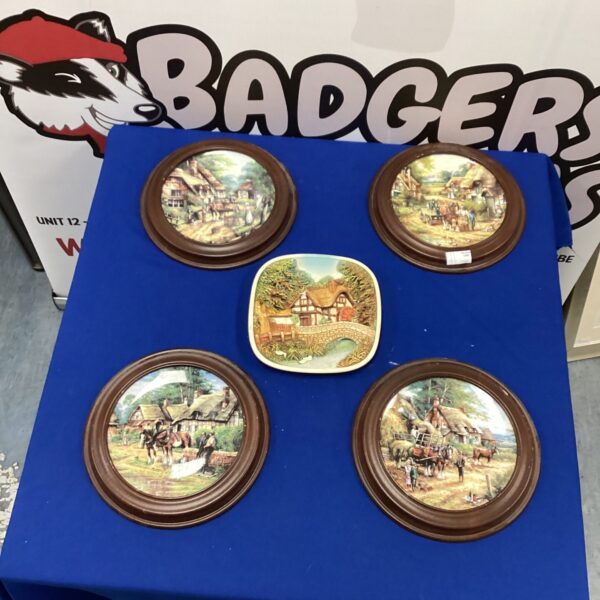 Framed Wedgewood collectors plates depicting horses in a scenic landscape.
