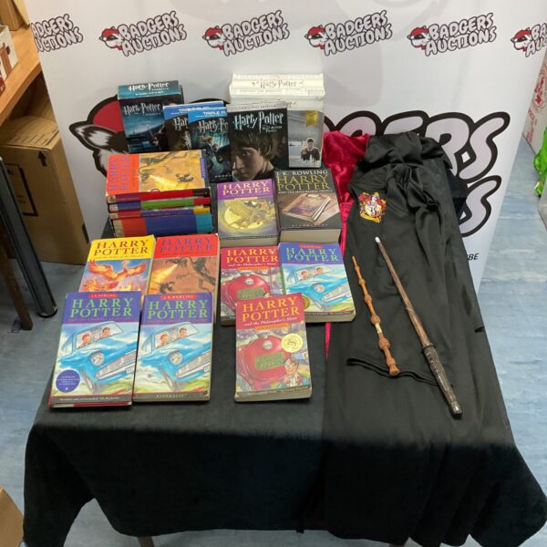 Harry Potter collection featuring books, DVDs, and a Gryffindor cloak.