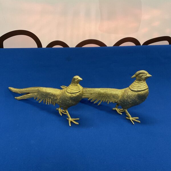 Vintage brass pheasants, a decorative pair of bird sculptures.