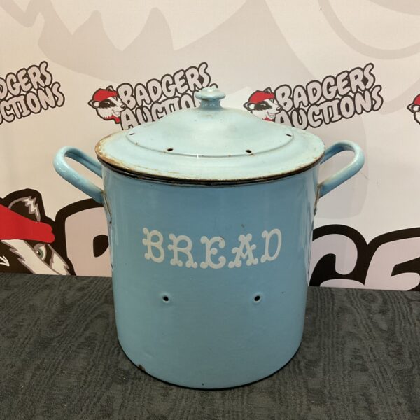 Pale blue vintage enamel bread bin with hinged lid.