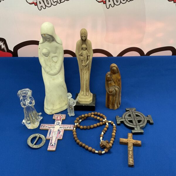 Vintage religious icon collection featuring a Virgin Mary statue and crucifixes.
