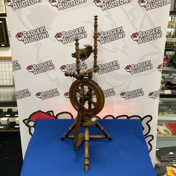 Vintage wooden spinning wheel, a classic antique craft tool.