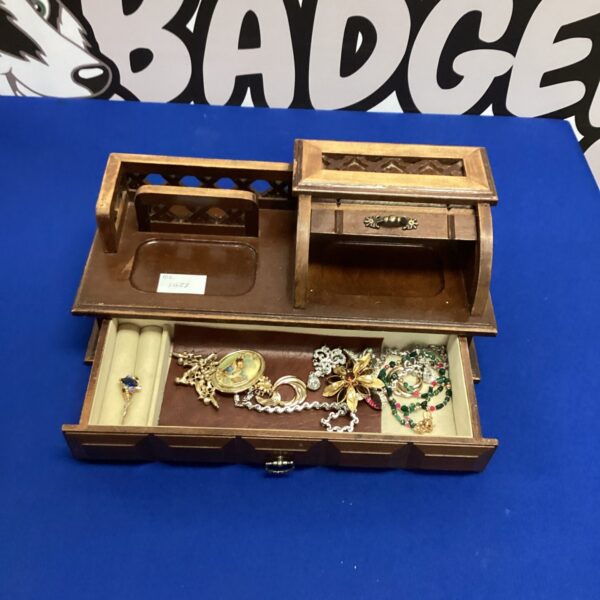 Vintage wooden desk pen holder with vintage jewellery inside.