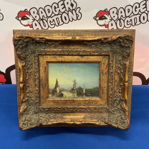 Antique oil painting of ships in a dock with gilt frame.