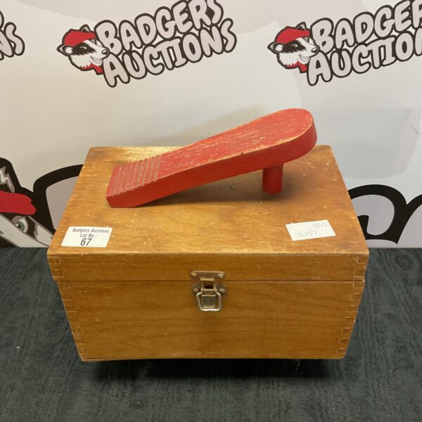 Vintage wooden shoe shine box with red polish.