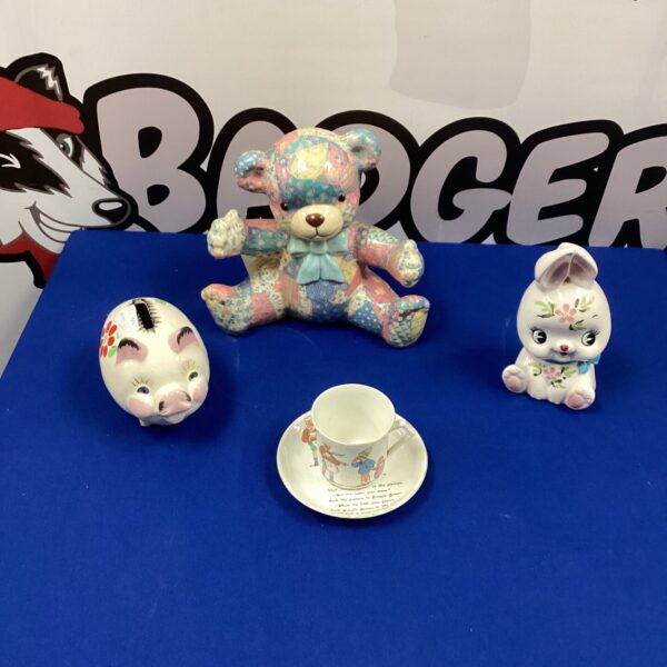 Vintage ceramic money box collection featuring a pig and duck.