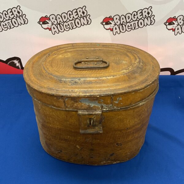 Antique toleware hat box with faded paint and vintage charm.