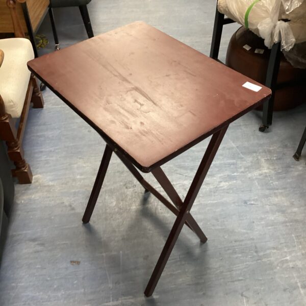 Simple wooden folding table for portable use.