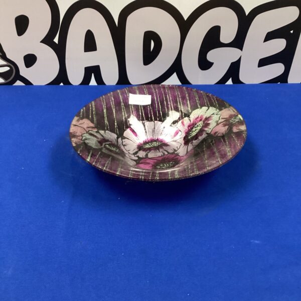 Vibrant hand-painted glass bowl with floral design.