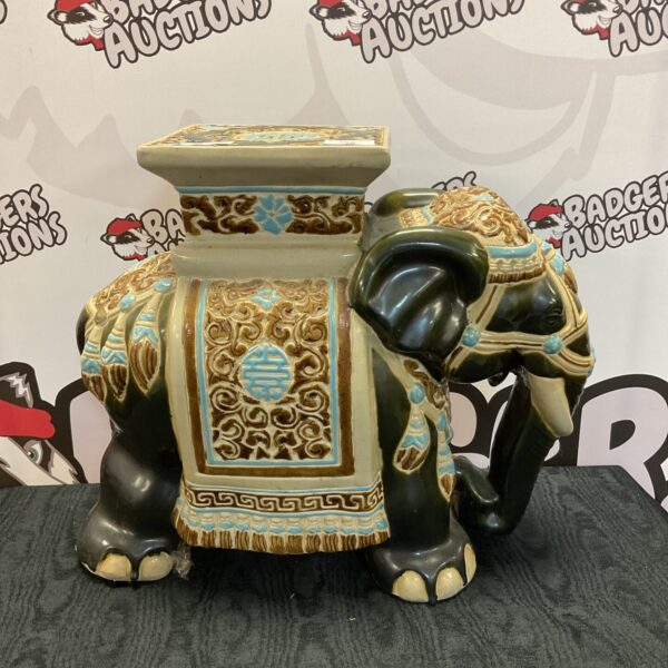Vintage pottery elephant plant stand with colourful detailing.