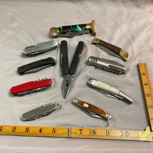 Vintage pocket knife collection lot with multiple folding knives.