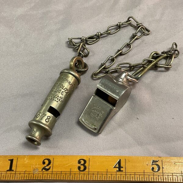 Antique Metropolitan Police whistle by Acme with chain.