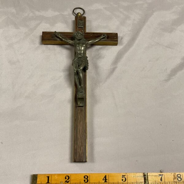 Vintage brass and wood crucifix for wall display.