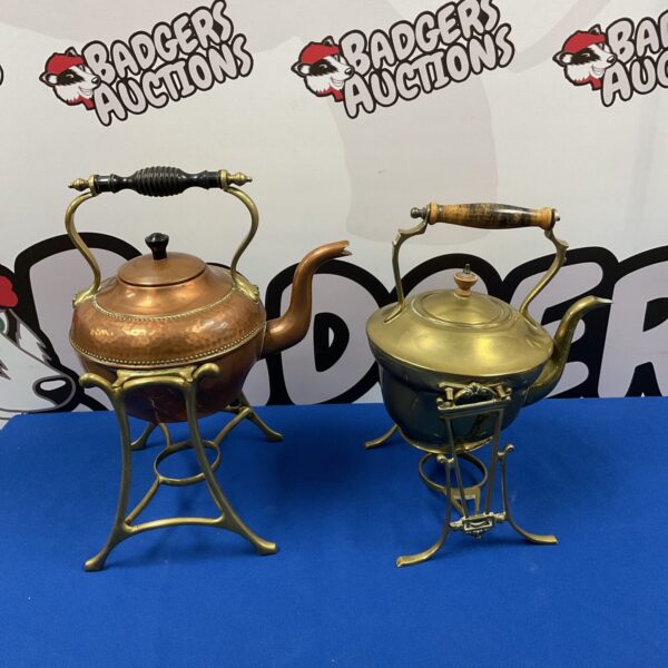 Ornate vintage copper and brass spirit kettle on display.