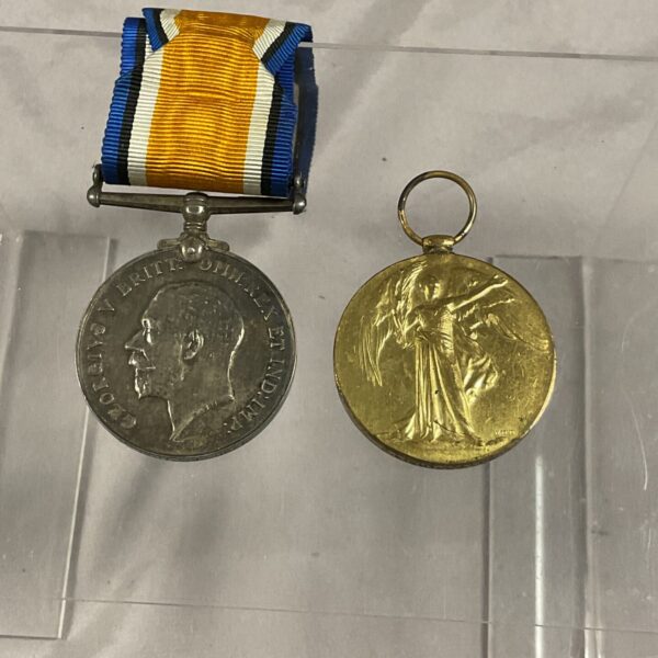 Front view of a WWI Victory Medal with rainbow ribbon.