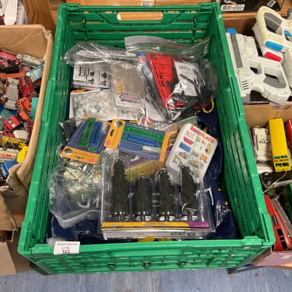 Crate of vintage train set accessories and parts.