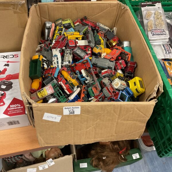 Vintage Moko Lesney diecast wheels in a cardboard box.